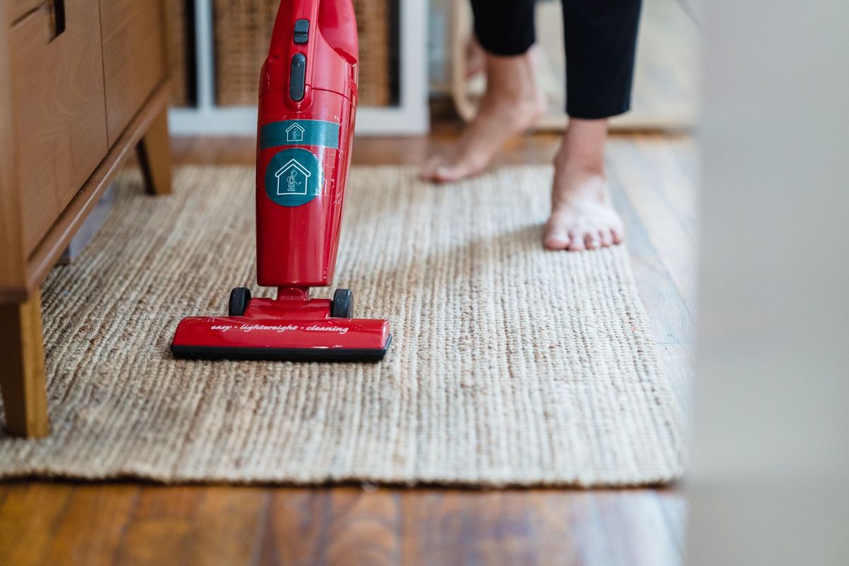Professional cleaner carefully refreshing a bright home in Miami, FL